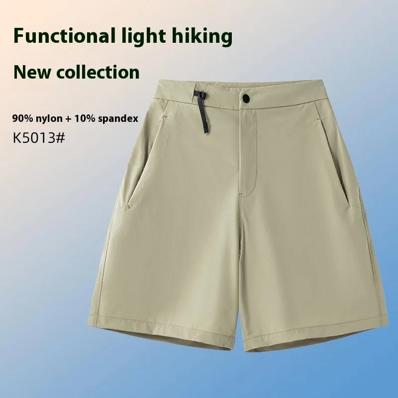 Men's solid colour quick-drying sports shorts with elastic waist on a neutral background.