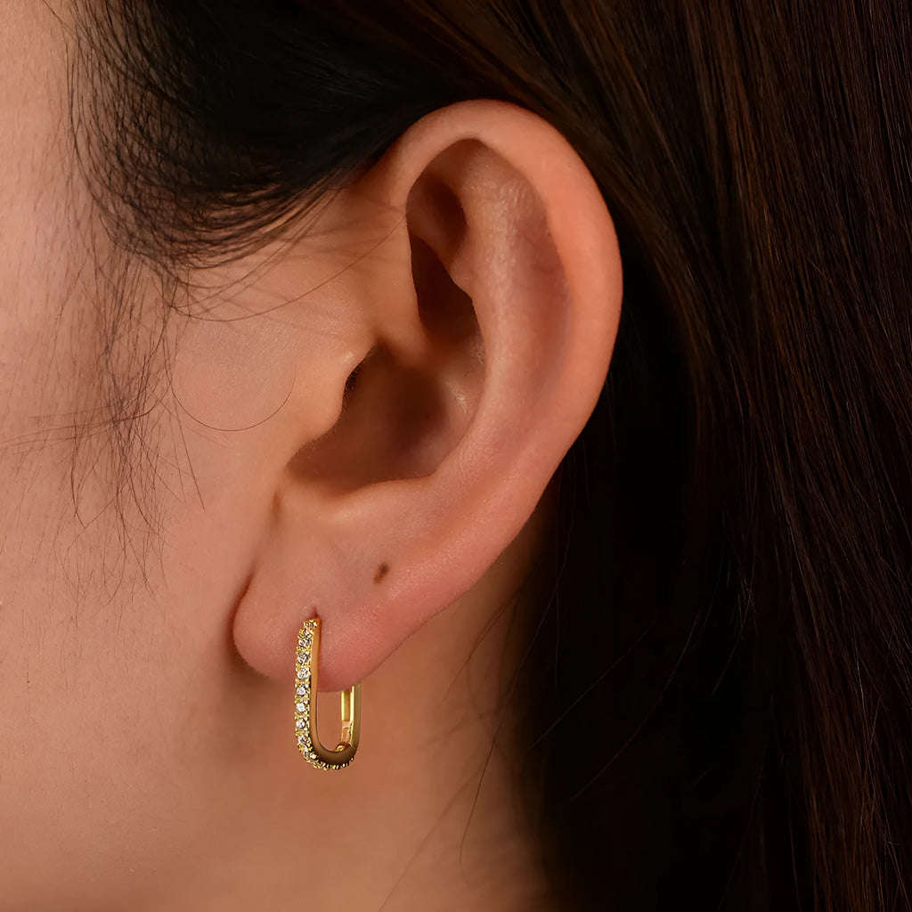 S925 sterling silver oval zircon ear clips with geometric design and diamond cut treatment