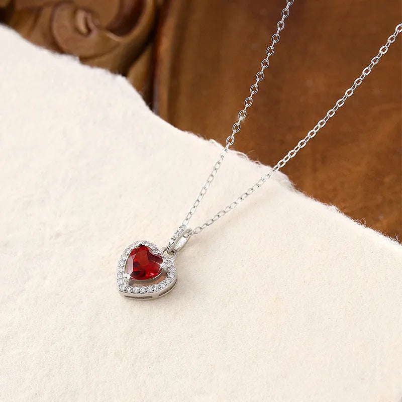 Women's sterling silver heart pendant necklace with natural coloured gemstone on cross chain