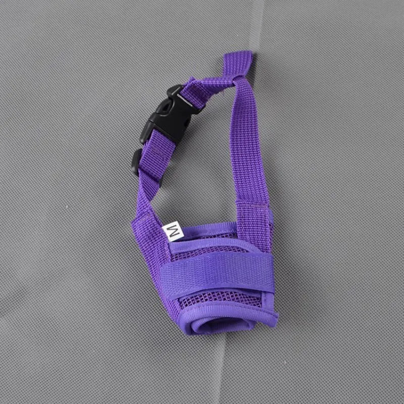 A plastic adjustable dog muzzle shown in multiple colours including black, blue, and pink.