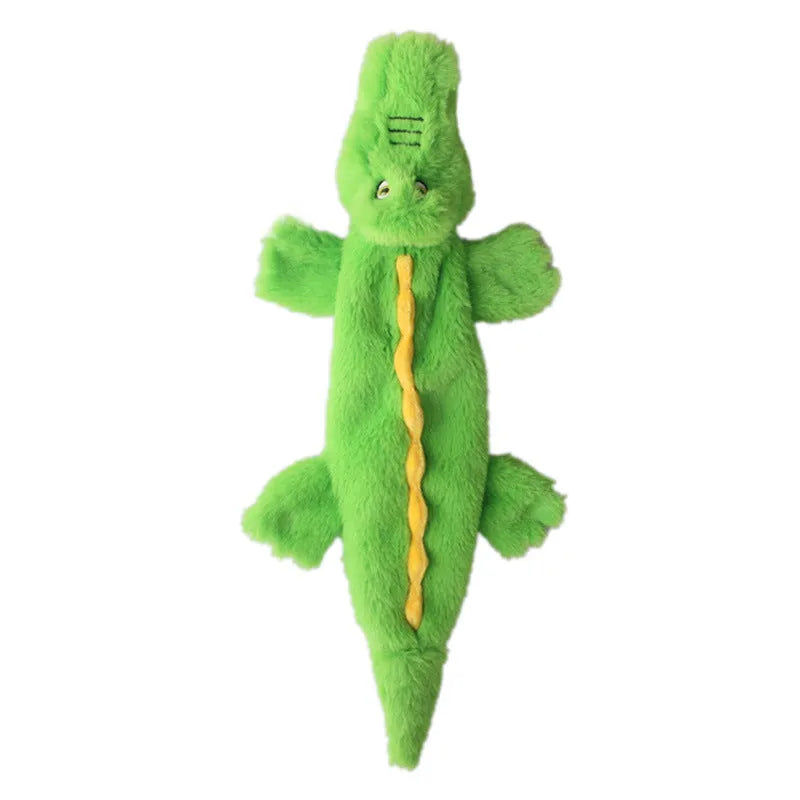 Green crocodile-shaped plush dog toy with squeaker in head and crinkle paper tail