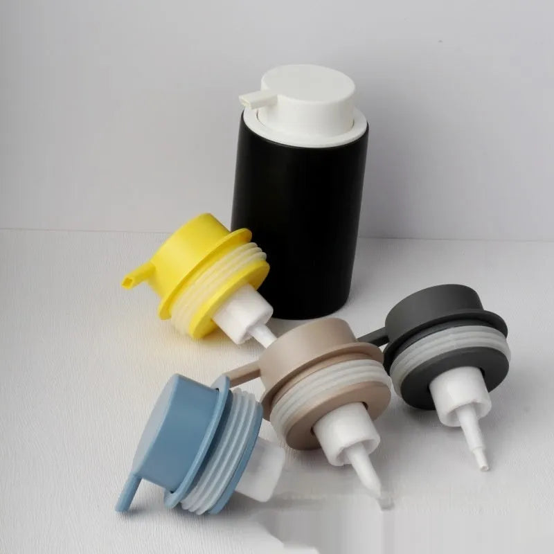 ABS plastic foam pump dispenser with large push head in metallic and matte black finishes.