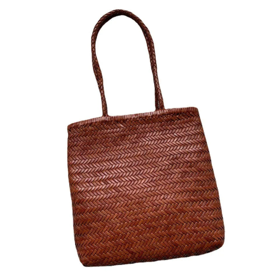 Handmade brown woven leather tote bag with three-dimensional pocket and shoulder strap