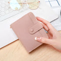 Ladies short wallet with lychee pattern in two-fold design showing four colour options