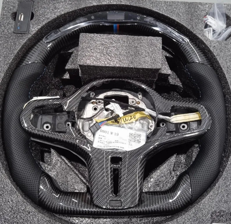 Black carbon fibre steering wheel for BMW X3 X5 with LED controls and sport package styling