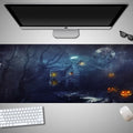Oversized Halloween-themed gaming mouse pad with non-slip base on a desk.