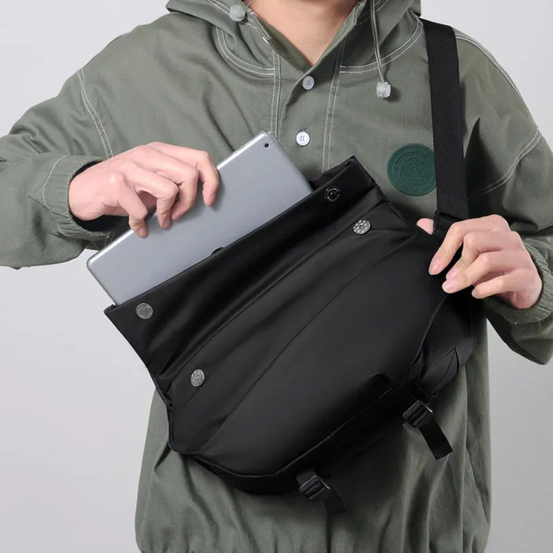 Grey PU leather crossbody sling backpack for men showing horizontal square shape and shoulder strap