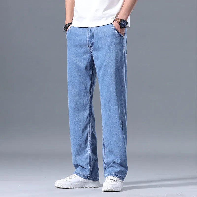 Men's loose straight-leg lyocell jeans in light blue colour with zipper fly.