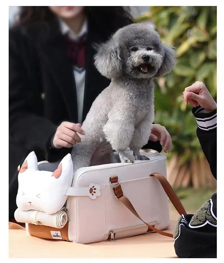 Beige hard-shell portable cat carrier flight case with one-shoulder strap, dimensions 43cm by 25cm by 22.5cm.