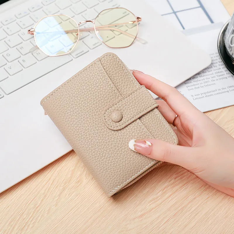Ladies short wallet with lychee pattern in two-fold design showing four colour options