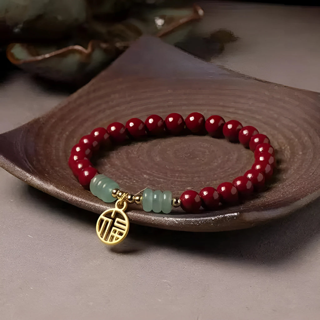 Handcrafted Chinese cinnabar bracelet with gold copper beads in wave design on wrist