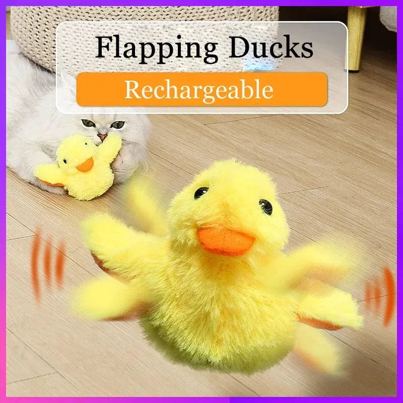Yellow chick-shaped electric interactive cat toy with plush cover on a plain background.