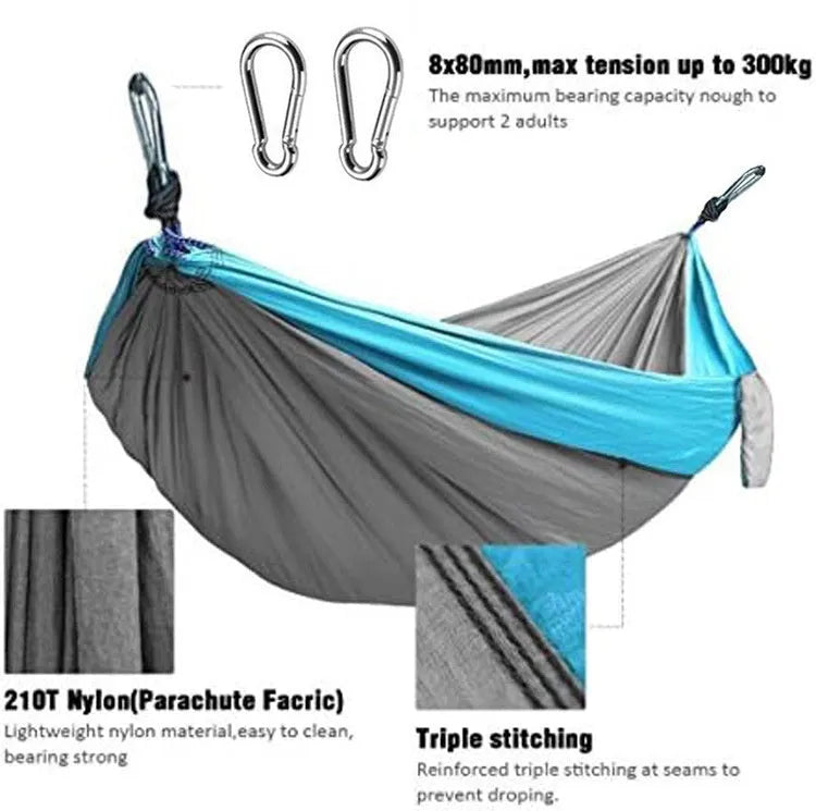 Blue parachute nylon outdoor camping hammock hung between two trees, showing its full 270 cm length.