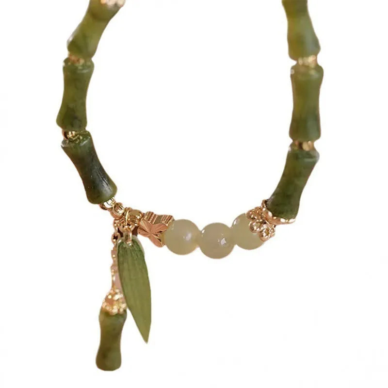 Chinese style bamboo leaf glass bracelet for women with a bamboo joint design.