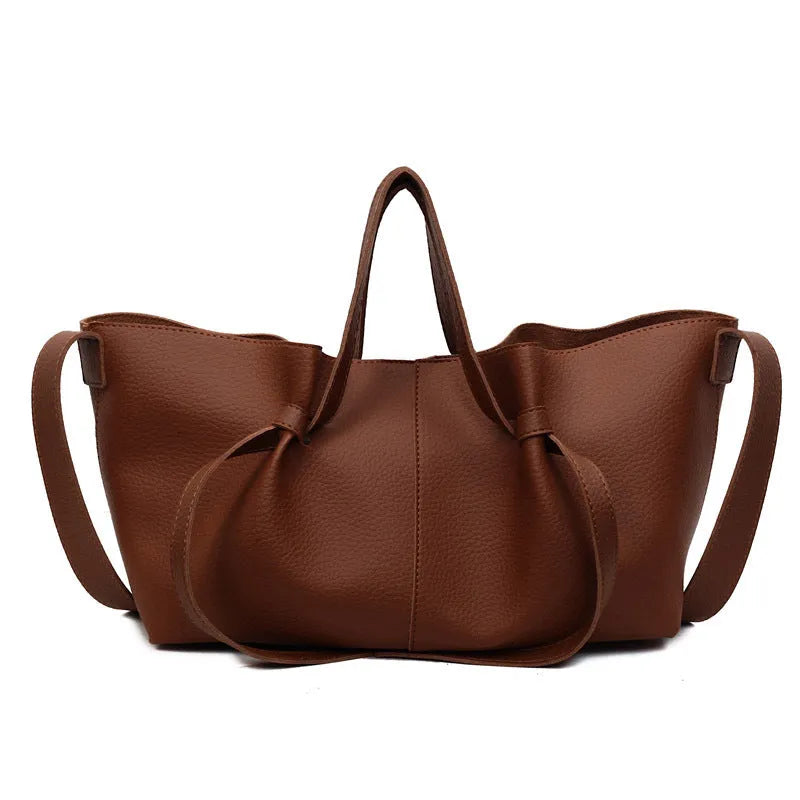 Large capacity one-shoulder crossbody bag in soft PU with sewing line detail, available in black, brown, coffee, gray