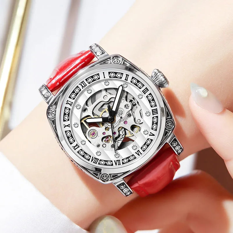 Mechanical watch with luminous numerals on a leather strap, shown in multiple colour options.
