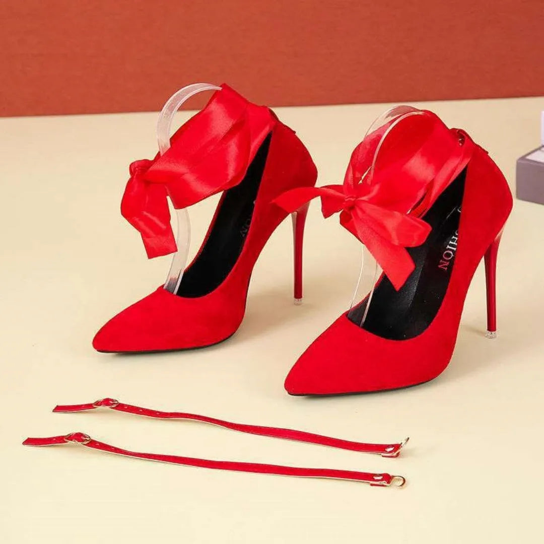 Black pointed toe high heel with lace ankle strap on a 12cm heel.