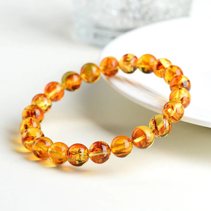 Natural yellow piebald amber bracelet with polished geometry beads for water purification