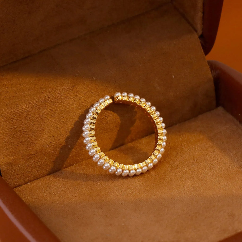 Gold geometric open-mouth women's ring with round pearl detailing on electroplated copper