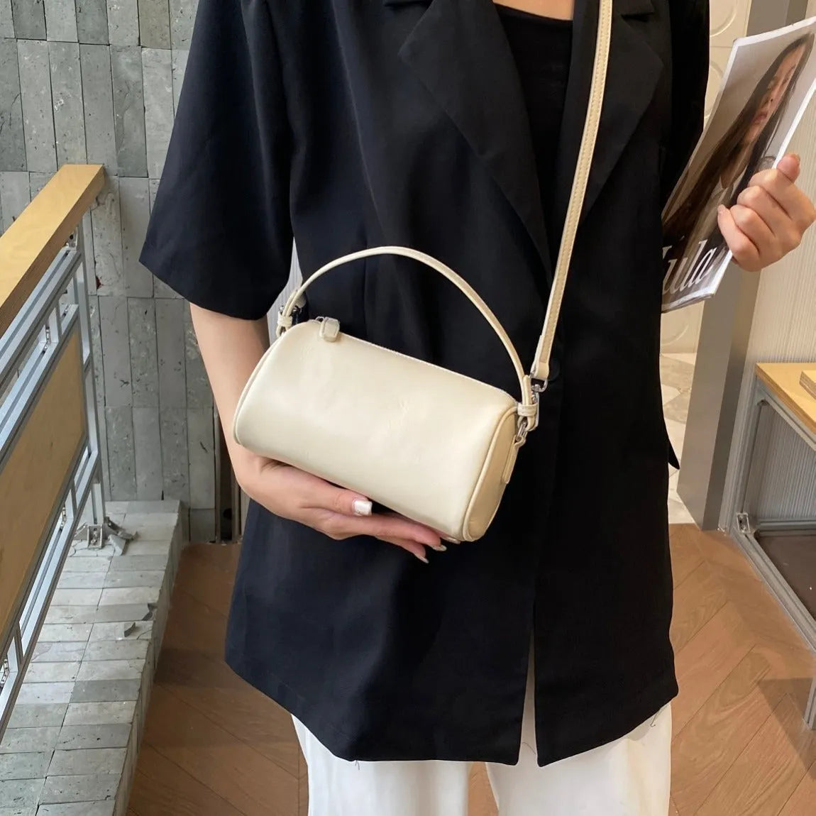 Genuine leather cylindrical crossbody phone bag in vegetable-tanned leather with single shoulder strap