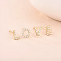 Brass gold plated alphabet letter earrings showing single English letter design with zircon stones