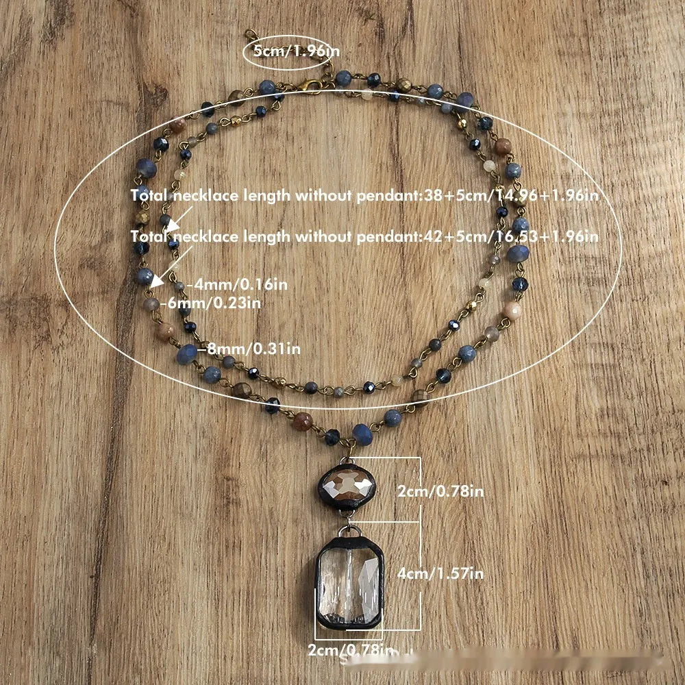 Tribal-style layered necklace with glass pendant and adjustable chain in beige or blue.