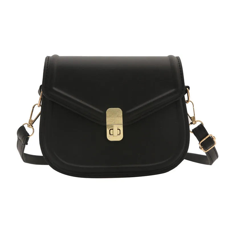 Soft black PU messenger bag with clamshell opening and niche texture, shown open.