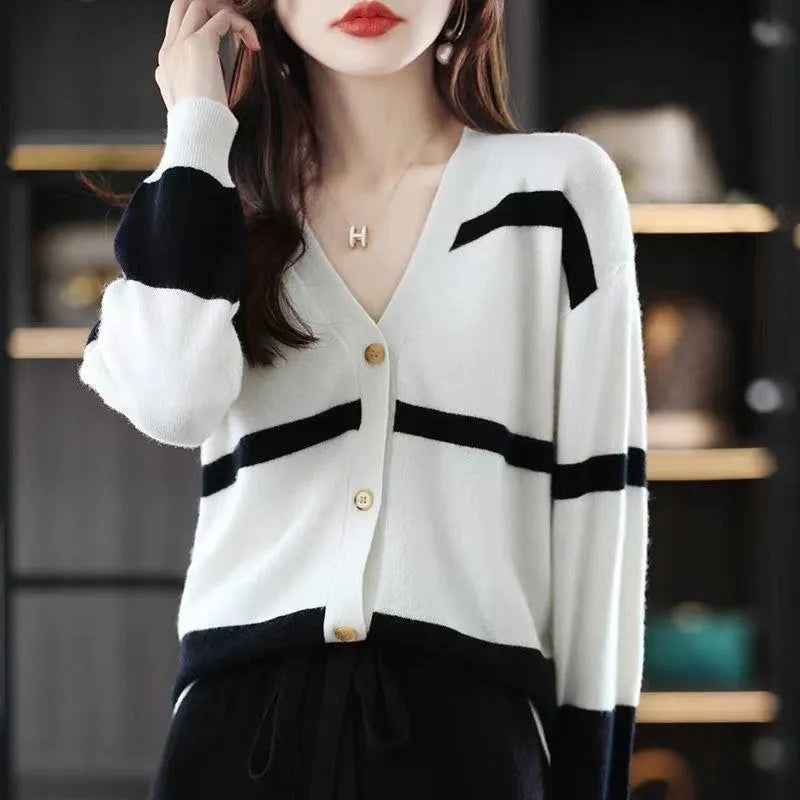 Women's slim fit V-neck cardigan with 3D striped pattern in black and white.