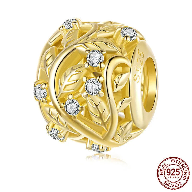 S925 sterling silver plated 14k golden leaf bead with 0.45cm aperture on white background
