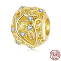 S925 sterling silver plated 14k golden leaf bead with 0.45cm aperture on white background