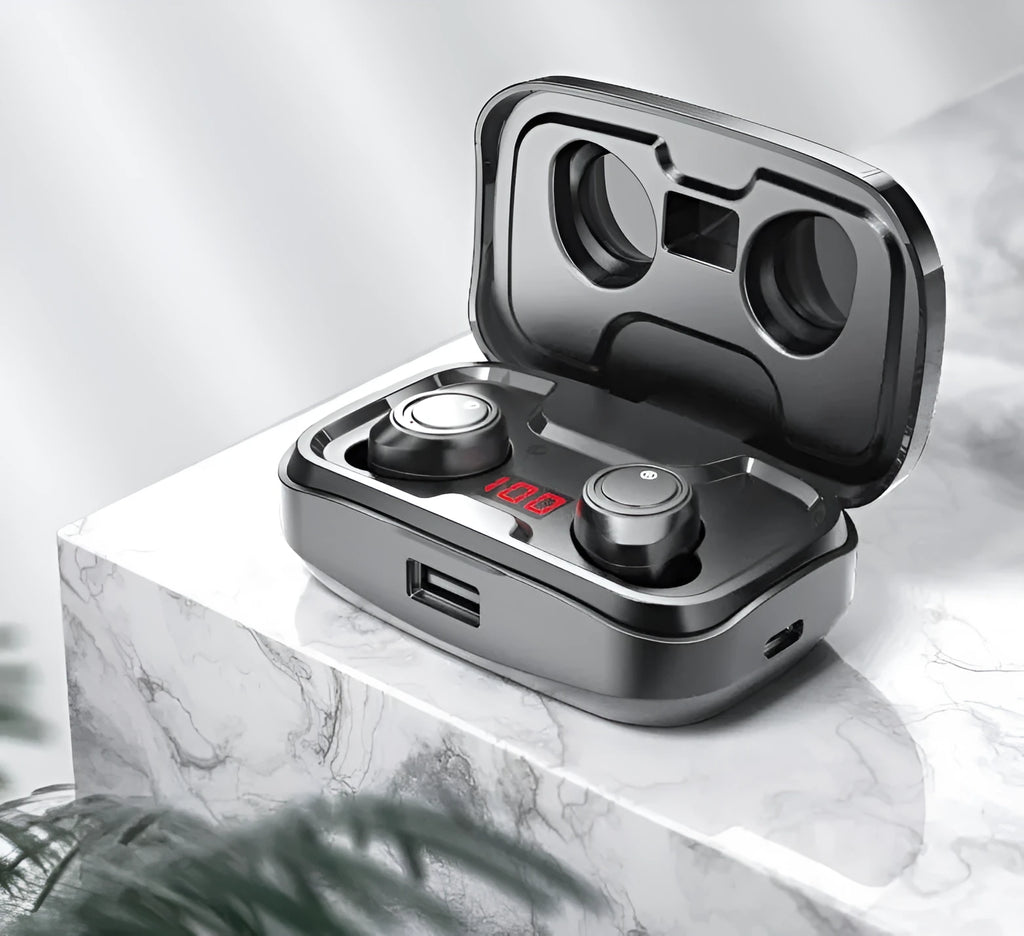 Black Bluetooth earplug-style headset placed inside its white plastic charging case.