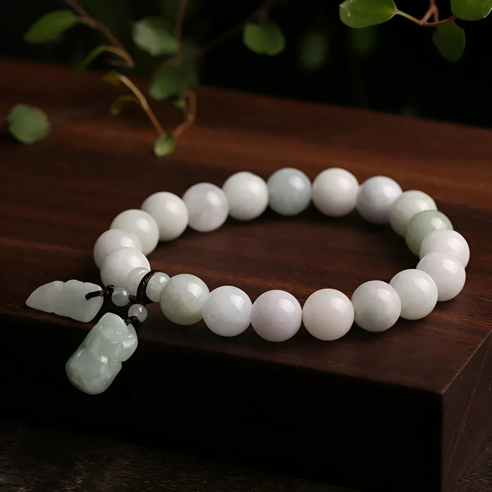 Natural jade hanging bracelet with carved pendant showing geometric design