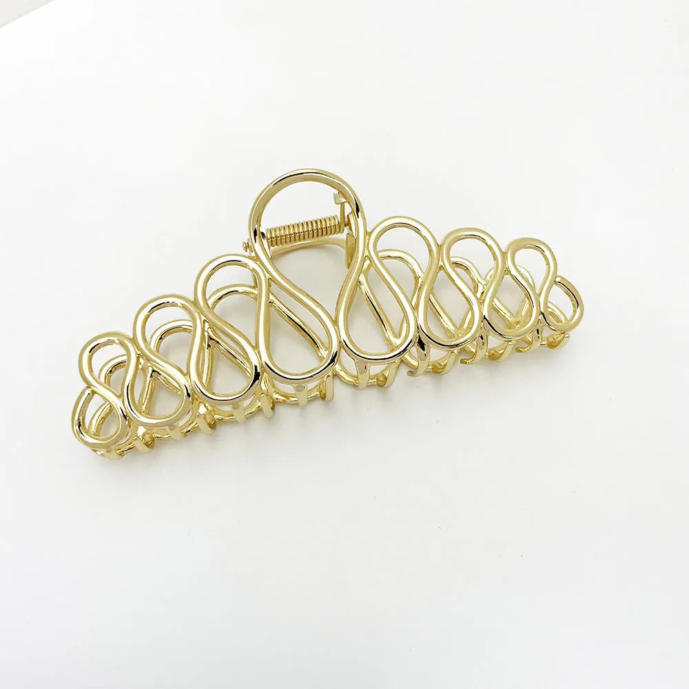 Gold and silver alloy hair clip with tassel detail for updo hairstyles