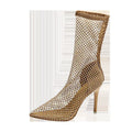 Gold coloured women's stiletto sandals with mesh upper and pointed toe.