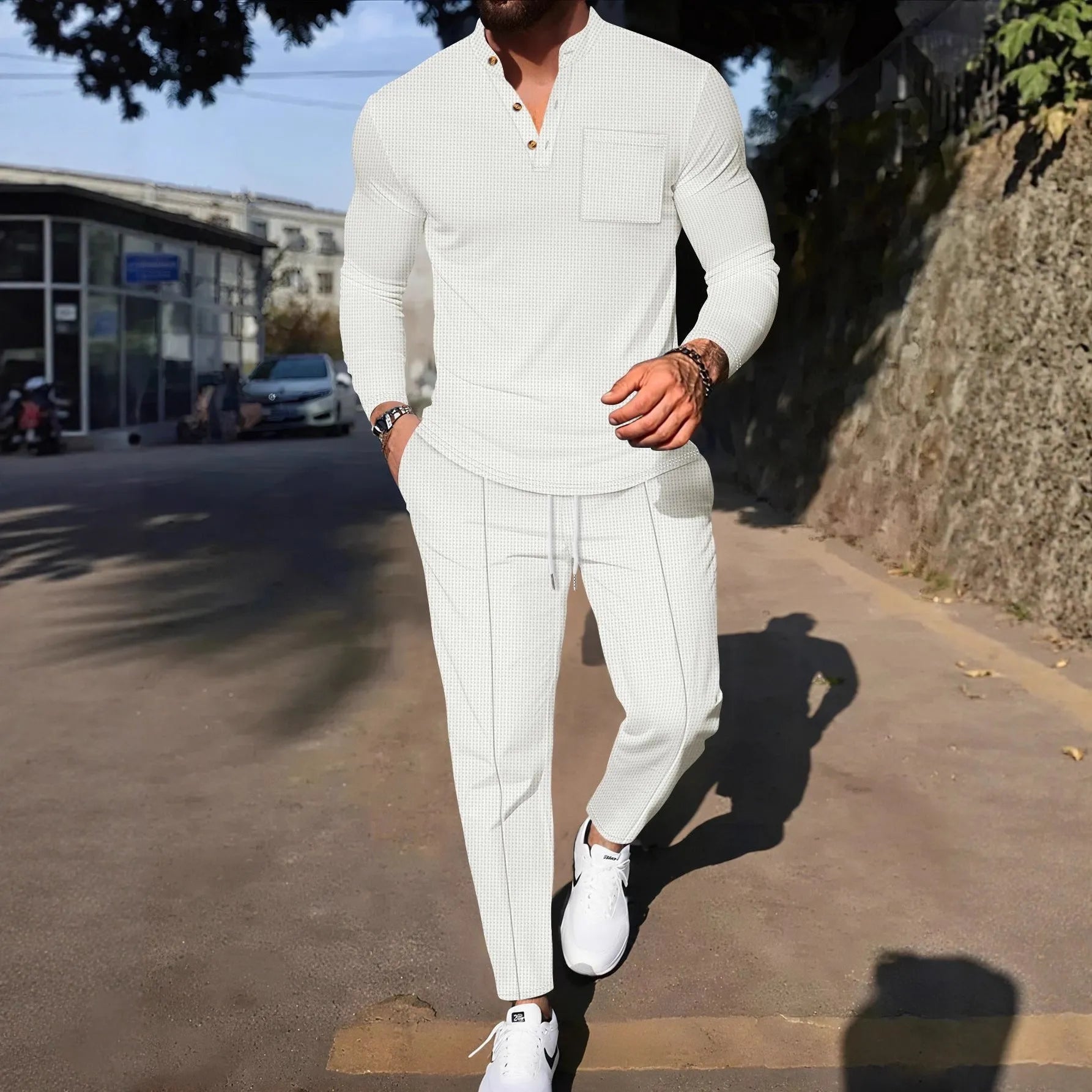 Men's waffle henley long sleeve t-shirt and matching long pants casual set in gray on a model