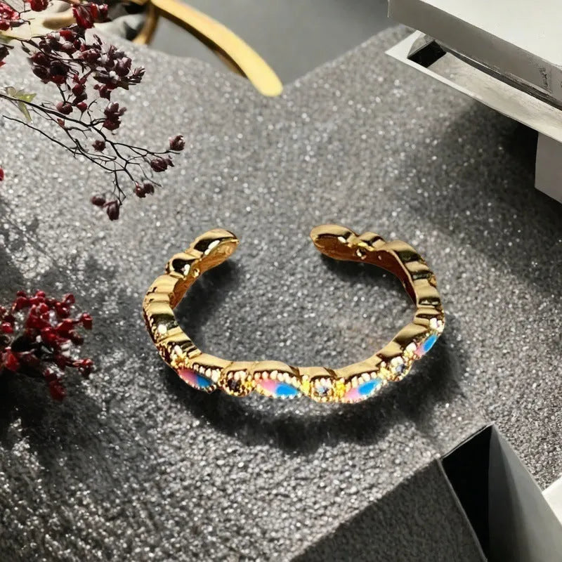 Adjustable copper women's ring with vintage oil drip finish, gourd shape, and inlaid zircon stones in floral and bow designs.