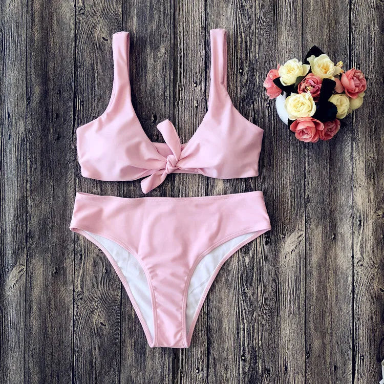 Ladies' polyester bikini set in solid red colour, showing bra top and briefs.