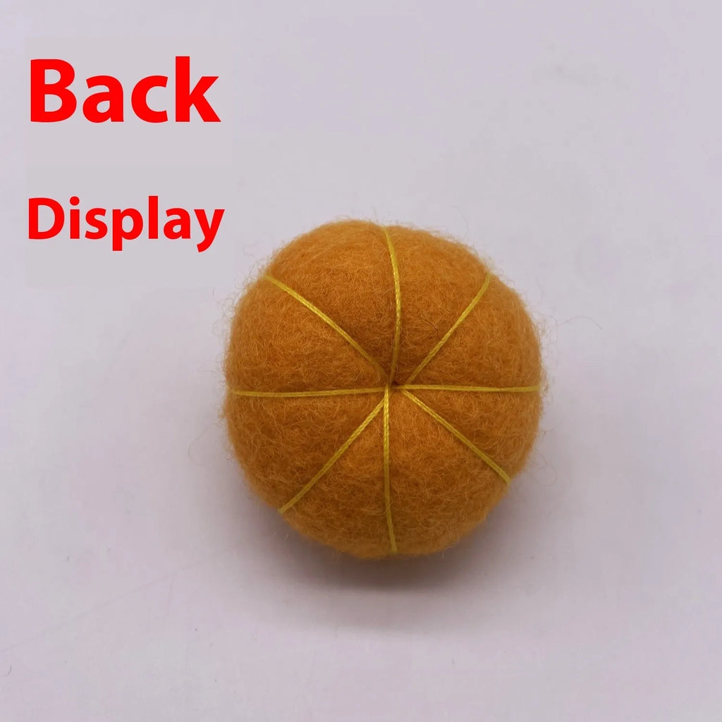 Wool felt pumpkin ornament decorations in autumn colours for seasonal displays