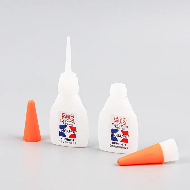 Tube of instant strong adhesive glue for specialised shoe sole and heel repairs.