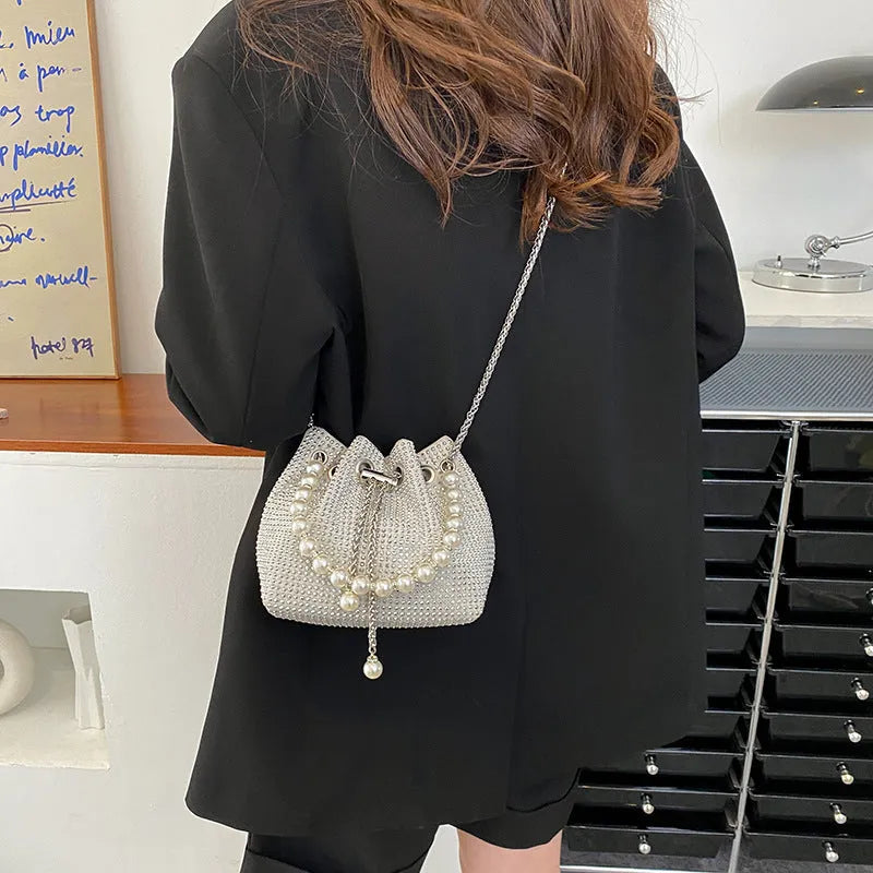 Western-style diamond shoulder bag with chain crossbody strap in bucket shape
