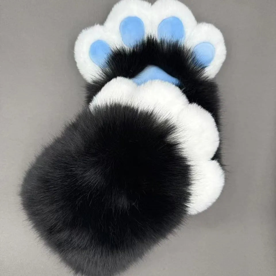 A pair of fingerless animal claw cosplay gloves in a white and pink colour combination with a coloured pad on the back.