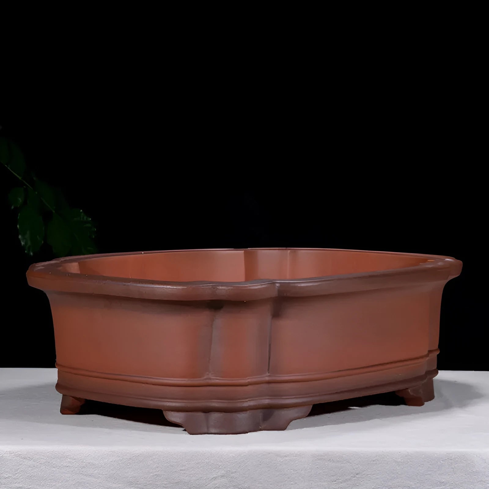 Large antique-finish Chinese purple clay flower pot with detailed tree stump and floral motif sculpture.