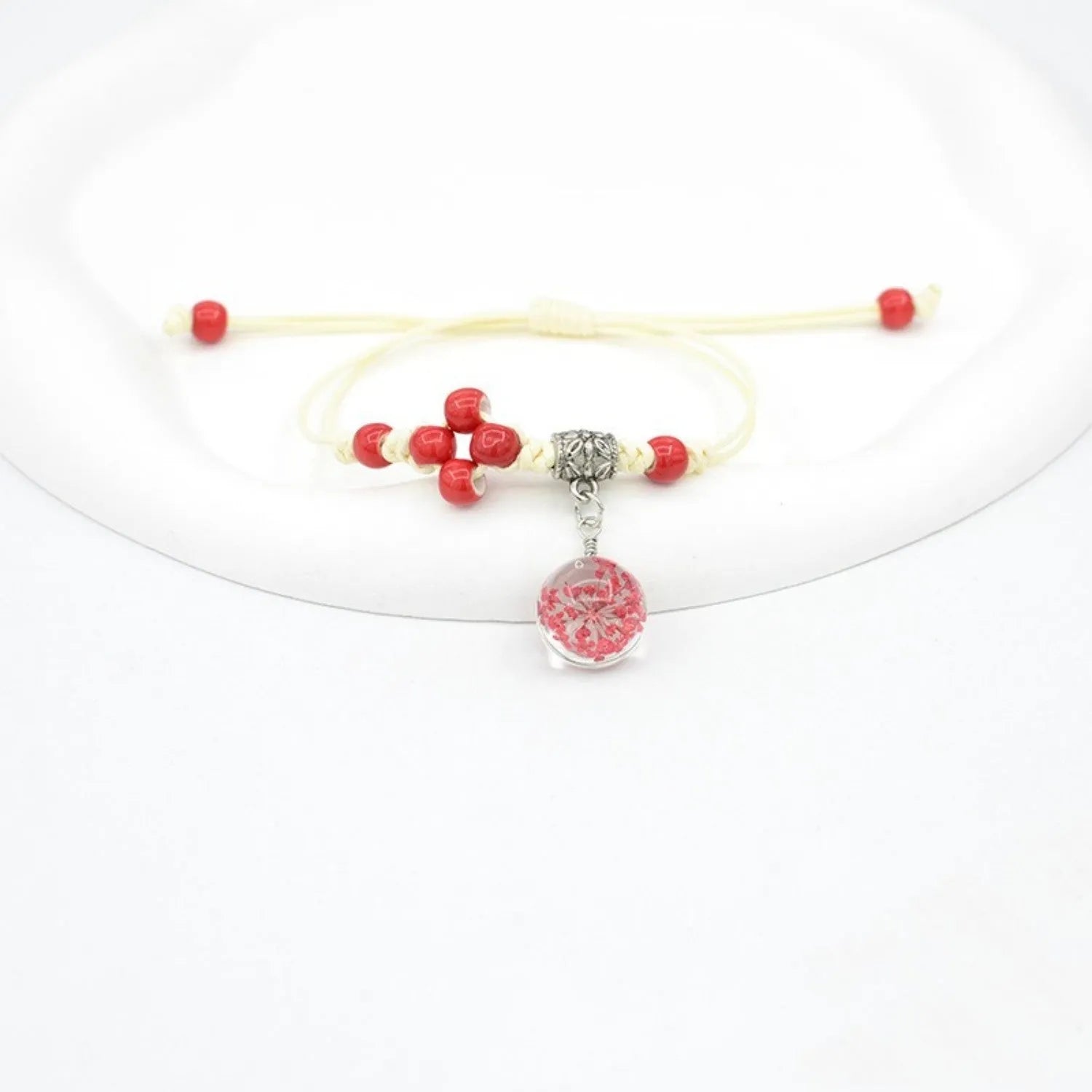 Glass bracelet with dried flowers inside 1.4cm beads on lace-style band in multiple colour options