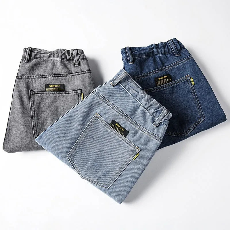 Men's loose straight jeans in cotton fabric showing mid waist fit and straight leg cut