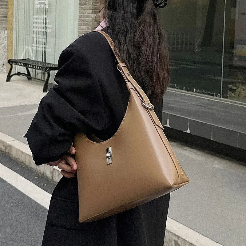 Genuine leather dumpling-shaped crossbody bag in apricot colour with shoulder strap