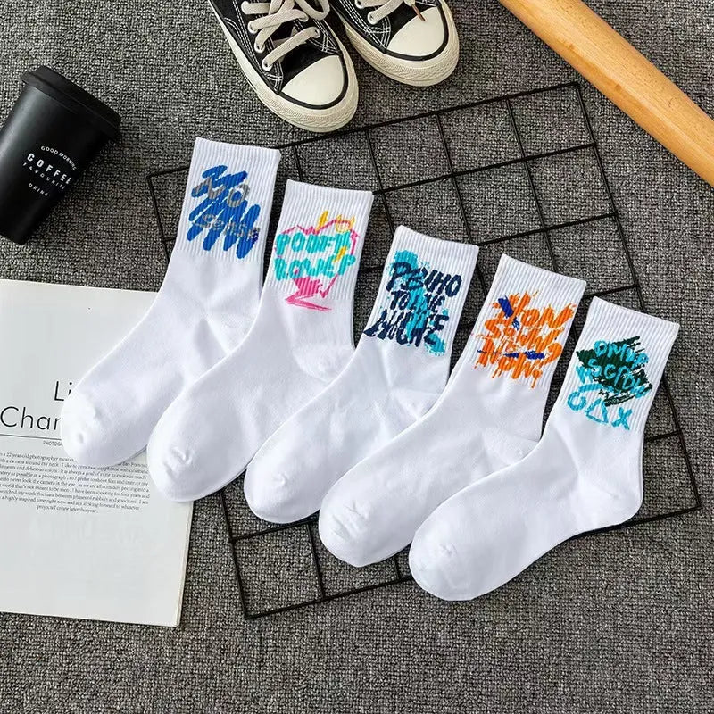 10 pairs of white cotton tube socks with graffiti pattern, middle calf length, on a plain background