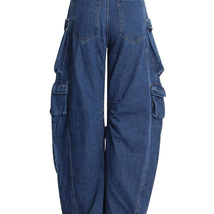 Dark blue distressed wide-leg jeans with a high waist and multiple pockets on a mannequin.