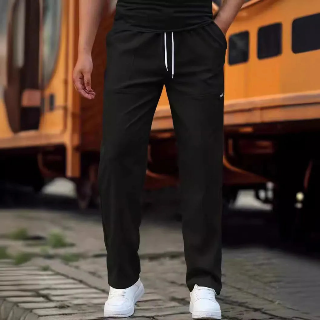 Men's polyester trousers for spring and autumn in light grey colour on a size chart