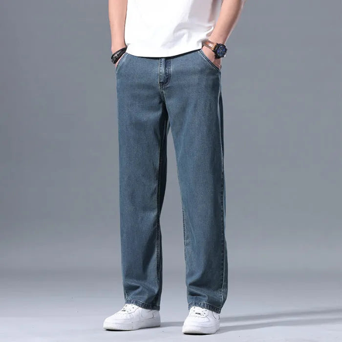 Men's loose straight-leg lyocell jeans in light blue colour with zipper fly.