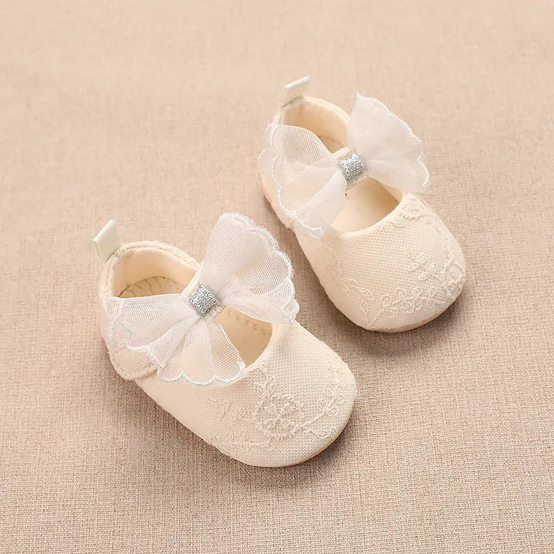 Spring baby toddler walking shoes with mesh upper, lace bow, and non-slip sole in solid colour